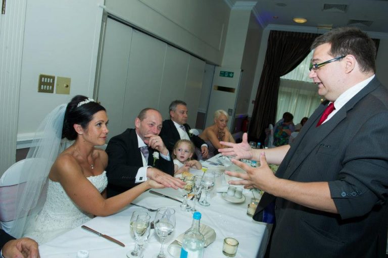 Table magician performing at a wedding