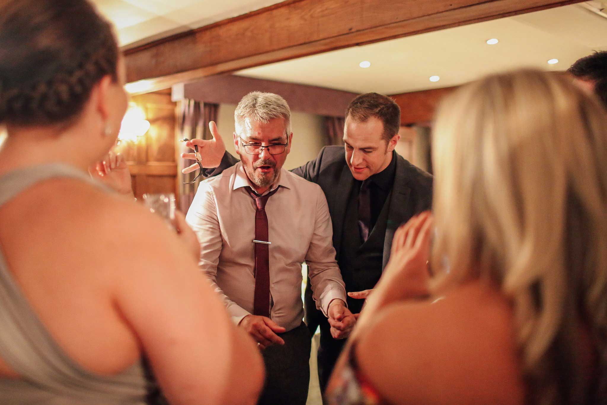 Pickpocket magician performing at wedding